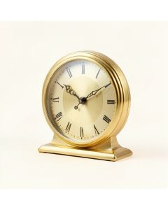 Analog Metal Mechanical Tabletop Clock In Gold (synthetic illustration; no displayed measurements)