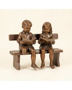 Boy And Girl Reading Books On Bench Bronze Statue - Size : 48 '' L X 29 '' W X 39 '' H . (synthetic illustration; no displayed measurements)