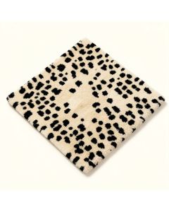 Thornbury Animal Print Tufted Wool Beige/Black Area Rug (synthetic illustration; no displayed measurements)
