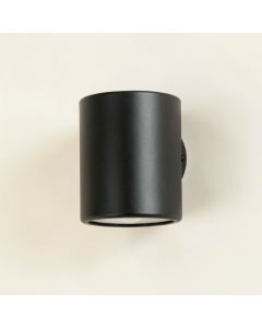 Field Arc Wall Sconce Mounted On A Plain Wall (synthetic illustration; no displayed measurements)