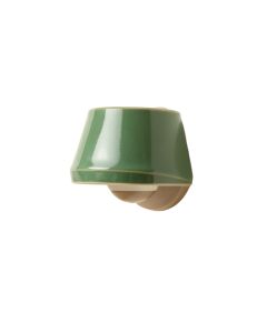 Holly Arc Wall Sconce Mounted On A Plain Wall