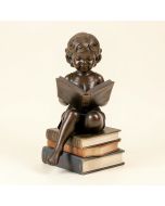 Bieber Girl Sitting On A Stack Of Books Reading A Book Statue (synthetic illustration; no displayed measurements)